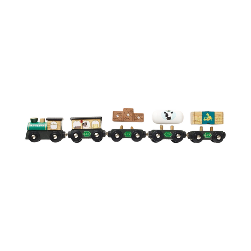 Grand train vert et wagons de marchandises